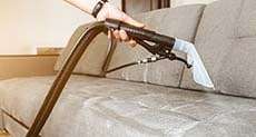 sofa cleaning with steam and shampoo